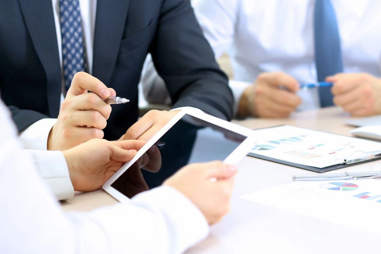 Business meeting with tablet and documents